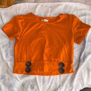 I am selling this gorgeous orange shirt. The brand is “Love J” and it is size S.